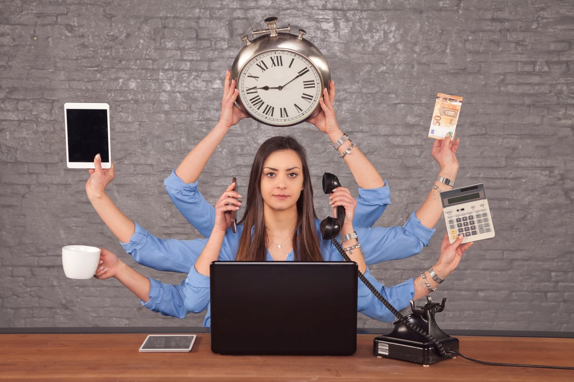 multitask businesswoman sat at the desk in the office, concept of well organized work